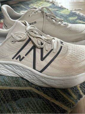 New Balance Men's Athletic Sneakers in Cream with Black Accents